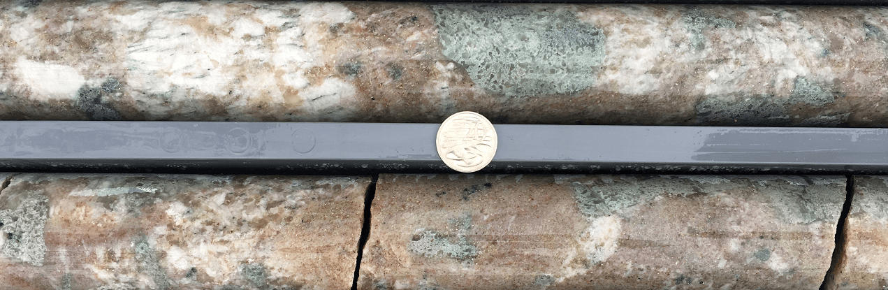 Mineral with coin 